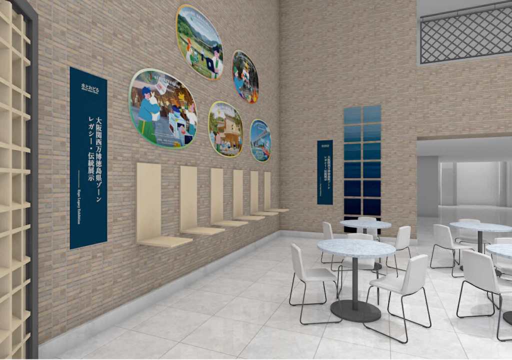 展示スペースには、大阪・関西万博に関する情報パネルとテーブルセットが配置された室内の様子